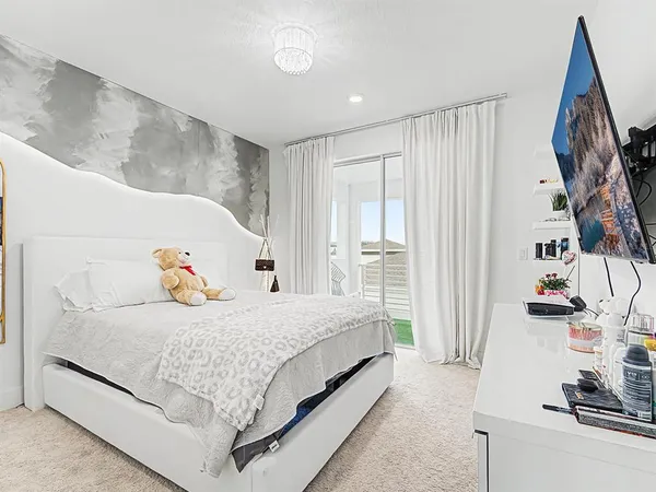 a bathroom with a shower sink vanity mirror and toilet