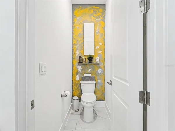 a workspace with furniture and a refrigerator