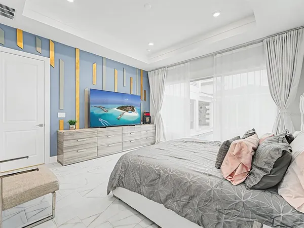 a bathroom with a sink a toilet a mirror and shower