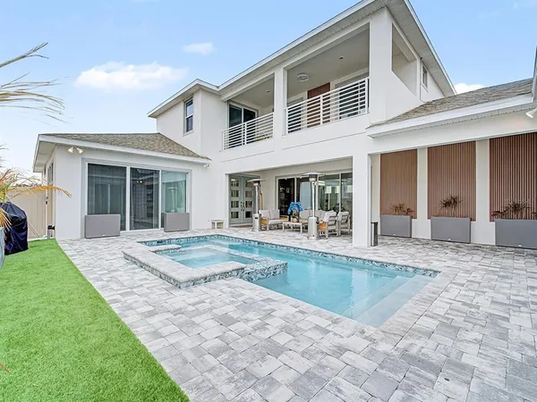 a kitchen with cabinets and a refrigerator
