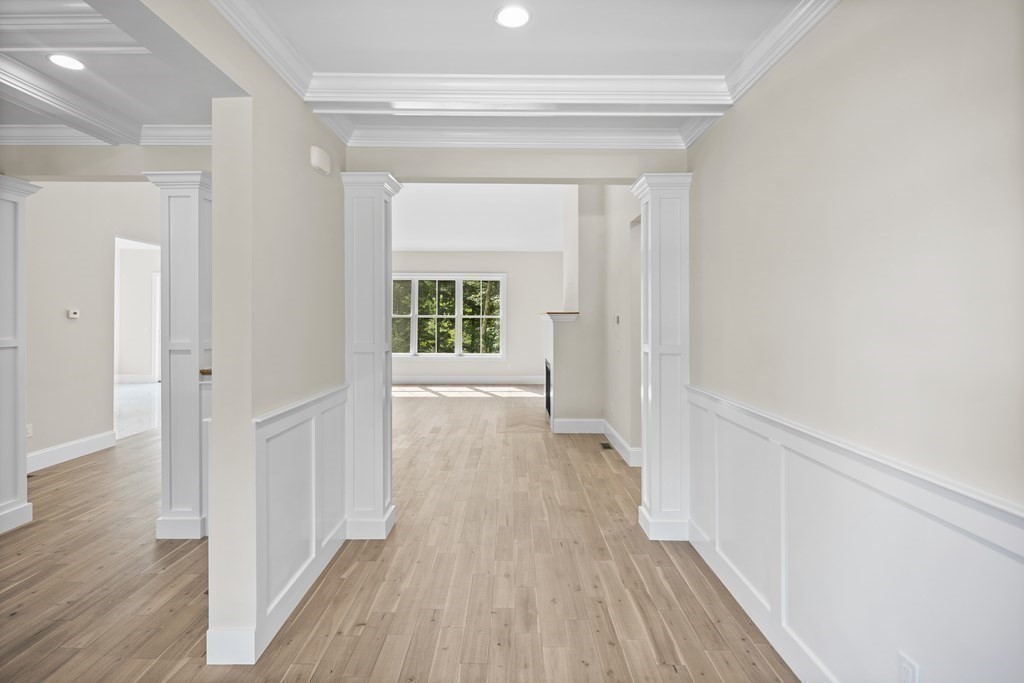 5 Isabella Circle Canton, MA 02021 - Photo 14 of 24 a view of a hallway with wooden floor and a living room
