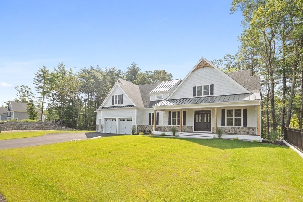 5 Isabella Circle Canton, MA 02021 - Photo 22 of 24 a front view of a house with swimming pool