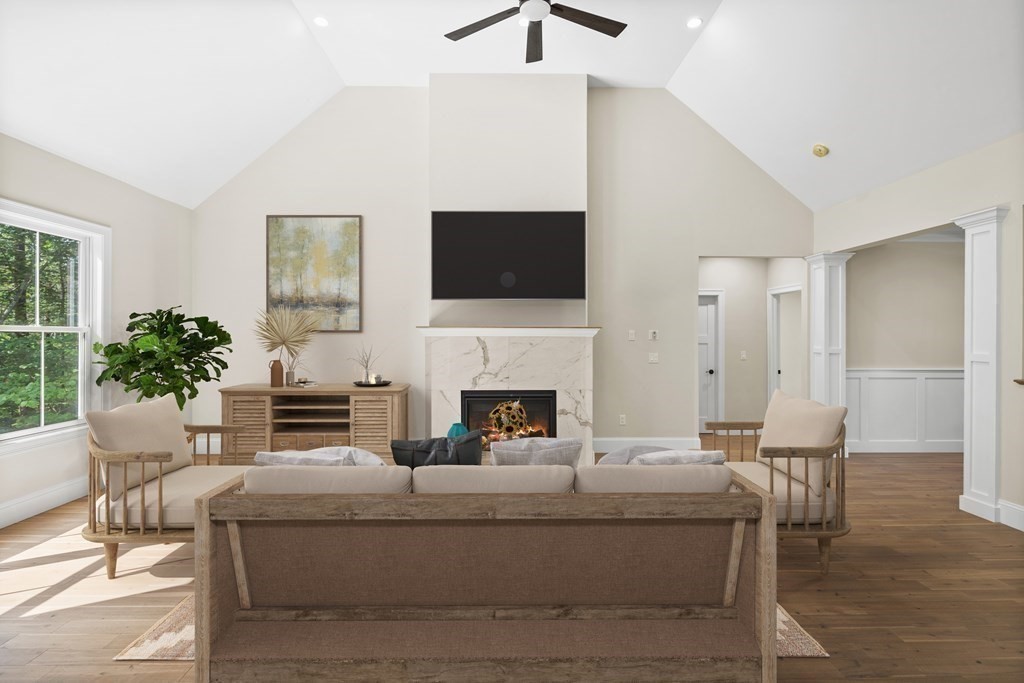 5 Isabella Circle Canton, MA 02021 - Photo 4 of 24 a living room with furniture a fireplace and a flat screen tv