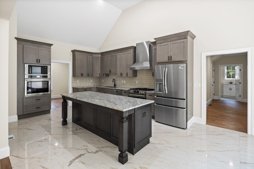 5 Isabella Circle Canton, MA 02021 - Photo 7 of 24 a kitchen with stainless steel appliances granite countertop a refrigerator and a stove