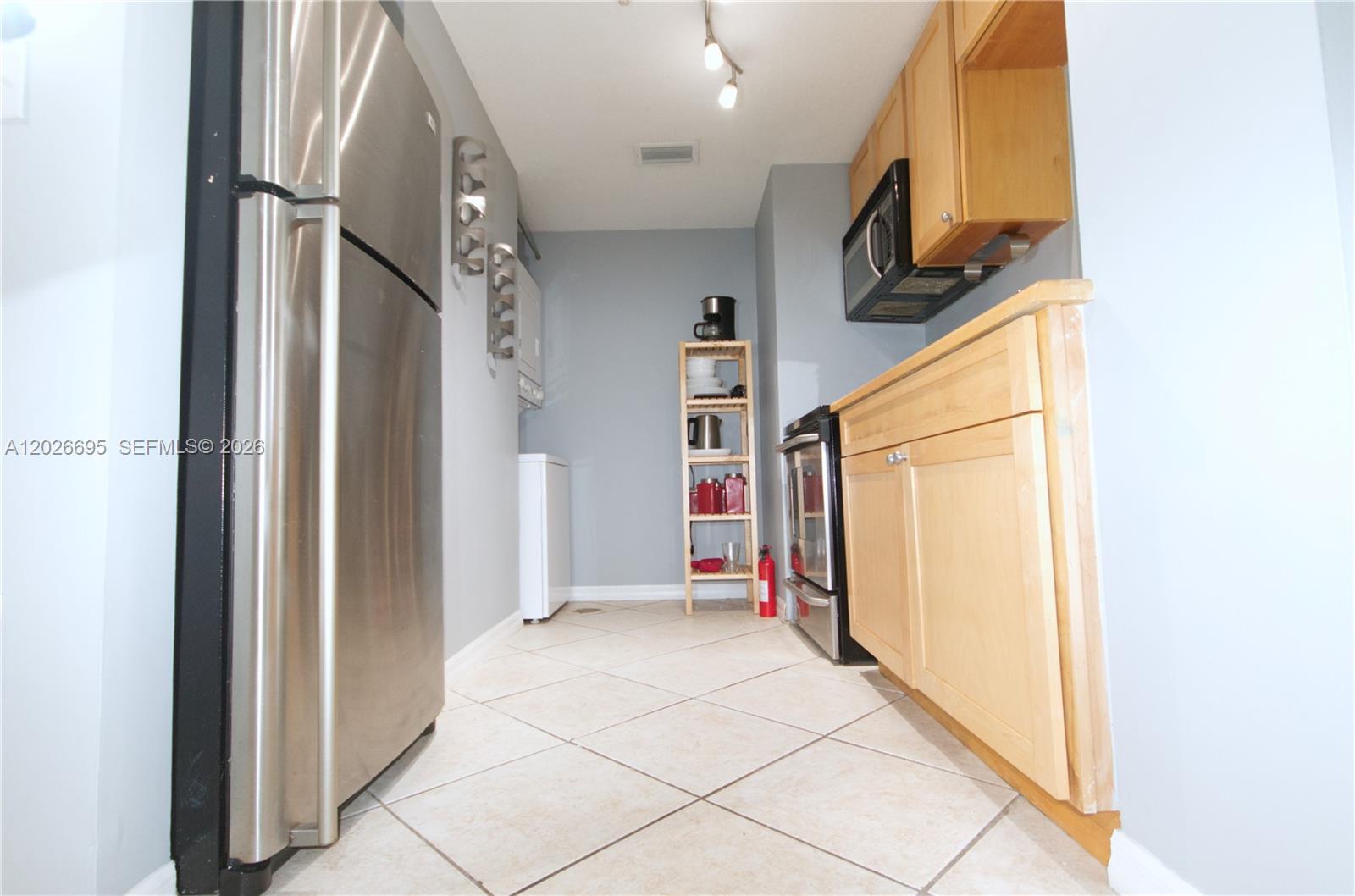 2630 Southwest 28th Street, Unit 22 Miami, FL 33133 - Photo 2 of 9 a view of an entryway with wooden floor