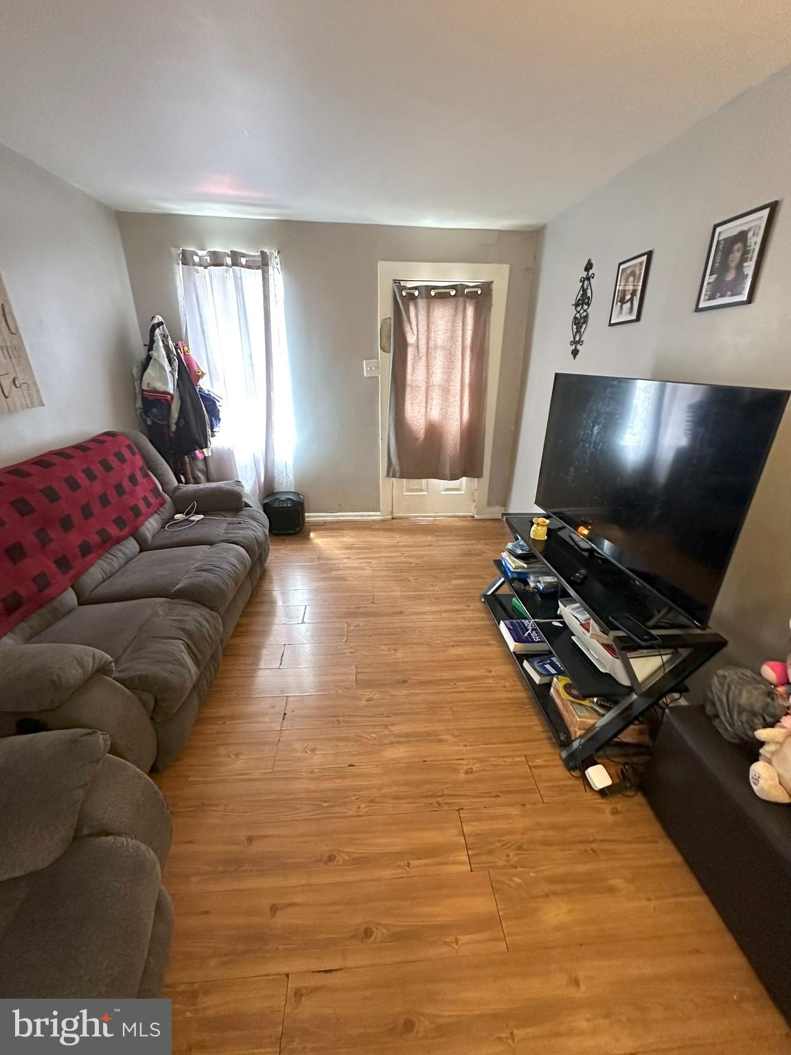 1053 Muhlenberg Street Reading, PA 19602 - Photo 2 of 10 a living room with furniture and a flat screen tv