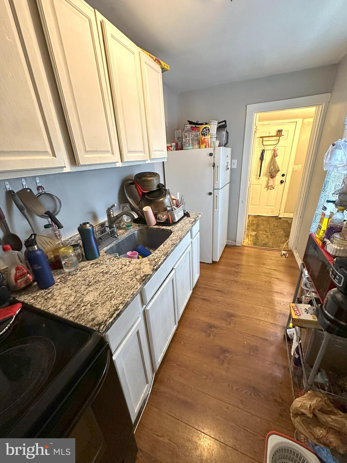 1053 Muhlenberg Street Reading, PA 19602 - Photo 4 of 10 a kitchen with sink refrigerator and window