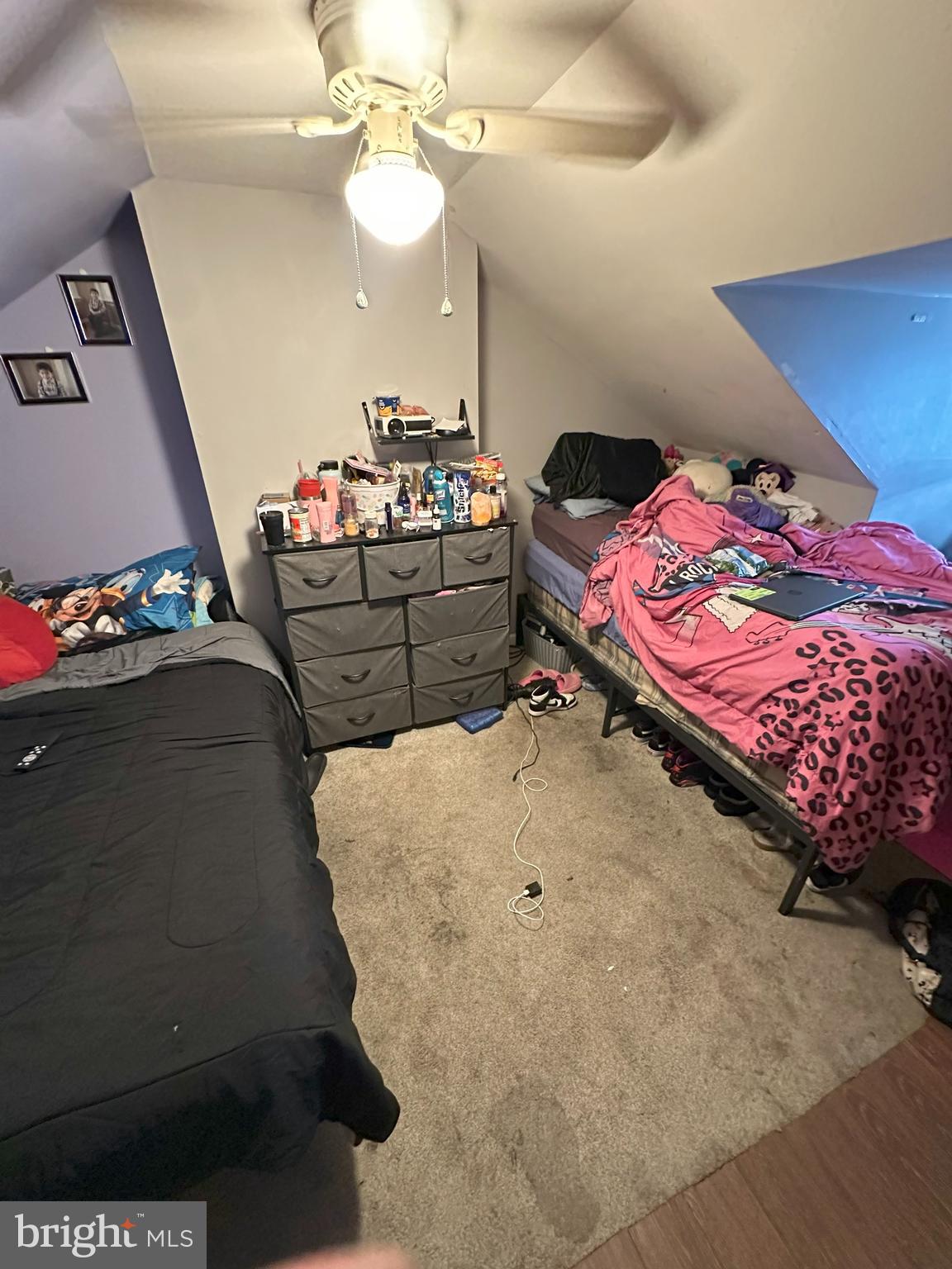 1053 Muhlenberg Street Reading, PA 19602 - Photo 6 of 10 a bedroom with a bed and a chandelier