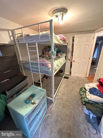 a bed room with furniture and a wooden floor