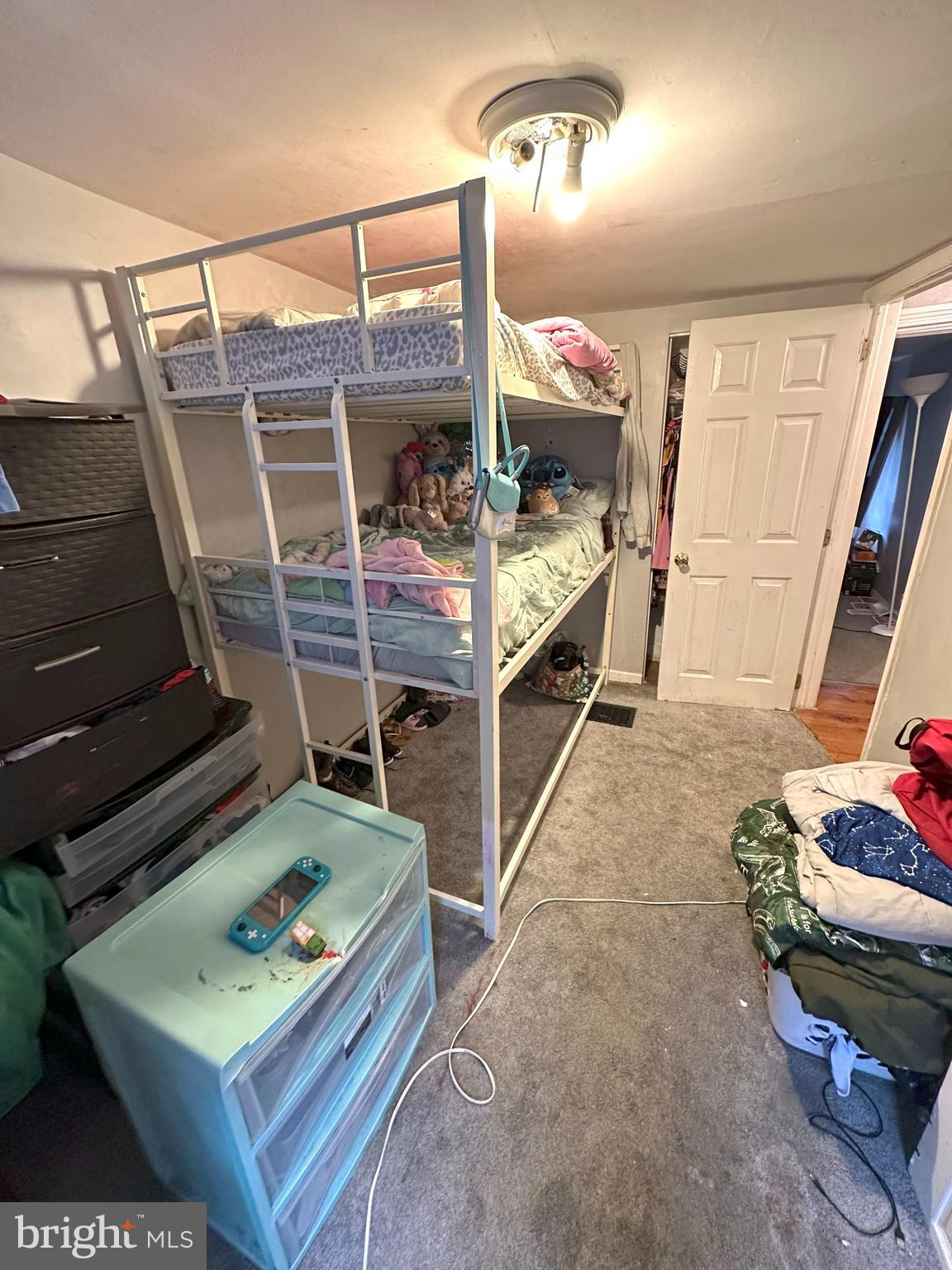 1053 Muhlenberg Street Reading, PA 19602 - Photo 8 of 10 a bed room with furniture and a wooden floor