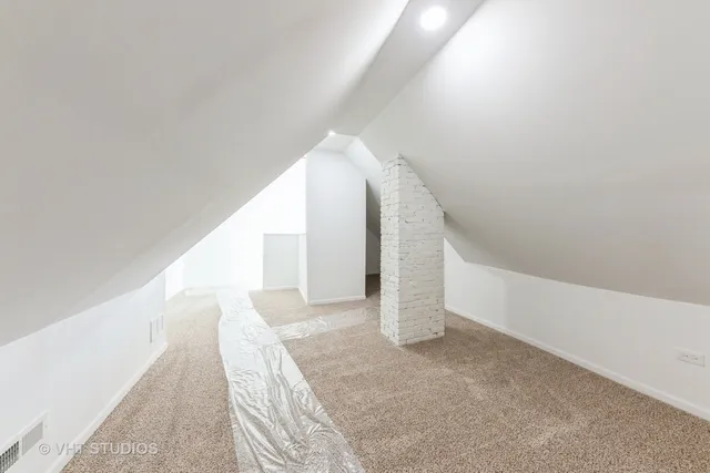 a view of a room with wooden walls