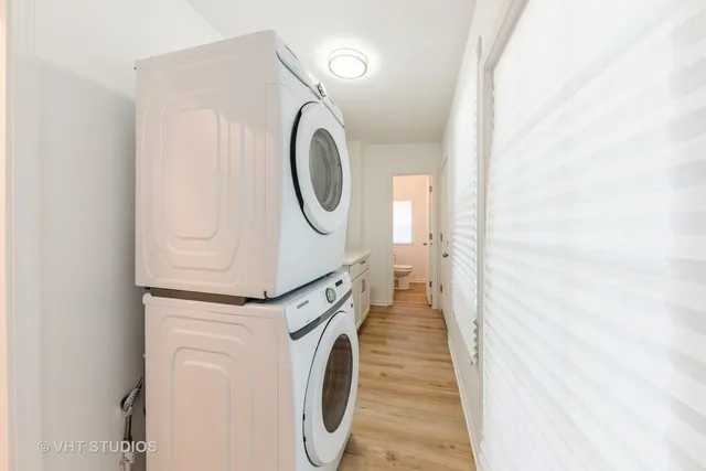 a view of a hallway with washer and dryer