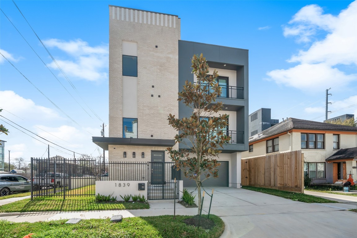 1839 Colquitt Street Houston, TX 77098 - Photo 1 of 19 a view of a big house with a big yard and large tree