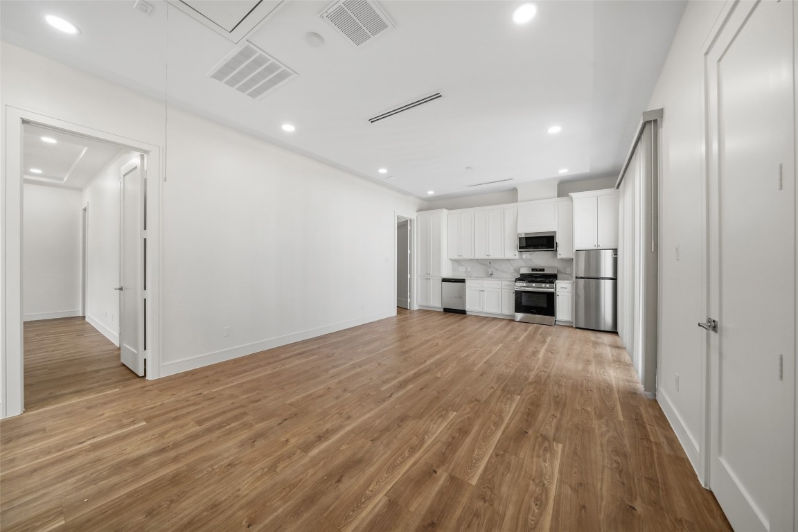 1839 Colquitt Street Houston, TX 77098 - Photo 17 of 19 a view of kitchen with stainless steel appliances refrigerator stove microwave and cabinets