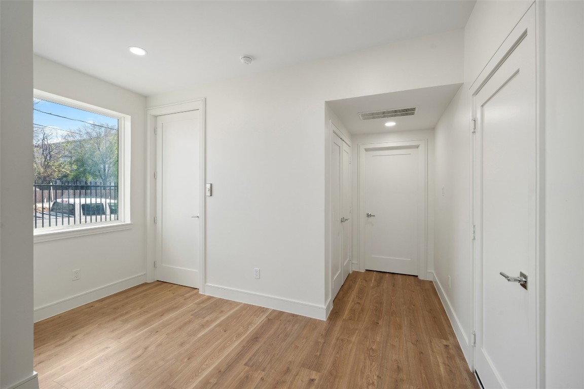 1839 Colquitt Street Houston, TX 77098 - Photo 4 of 19 a view of a room with wooden floor and windows