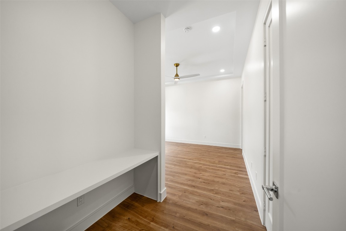 1839 Colquitt Street Houston, TX 77098 - Photo 6 of 19 a view of hallway with wooden floor