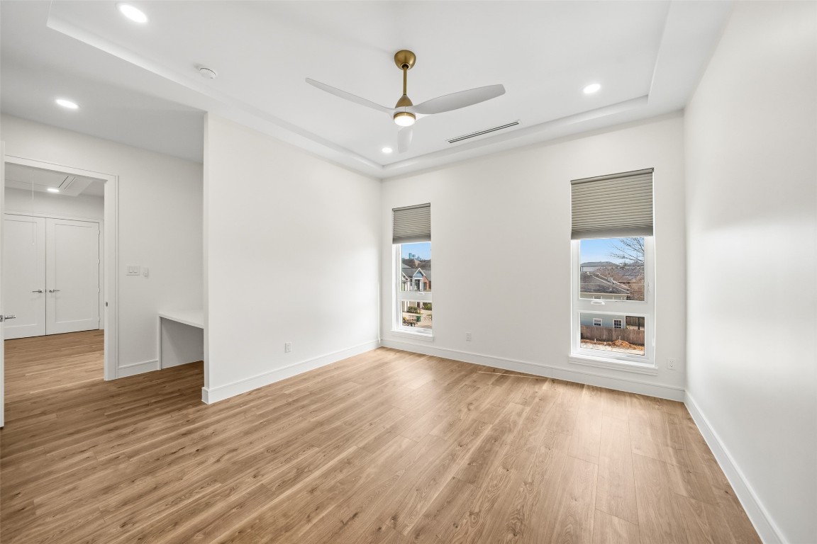 1839 Colquitt Street Houston, TX 77098 - Photo 8 of 19 wooden floor in an empty room with a window