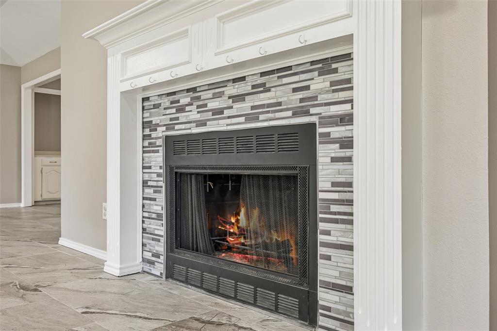 116 Timberview Court Burleson, TX 76028 - Photo 11 of 37 a living room with a fireplace