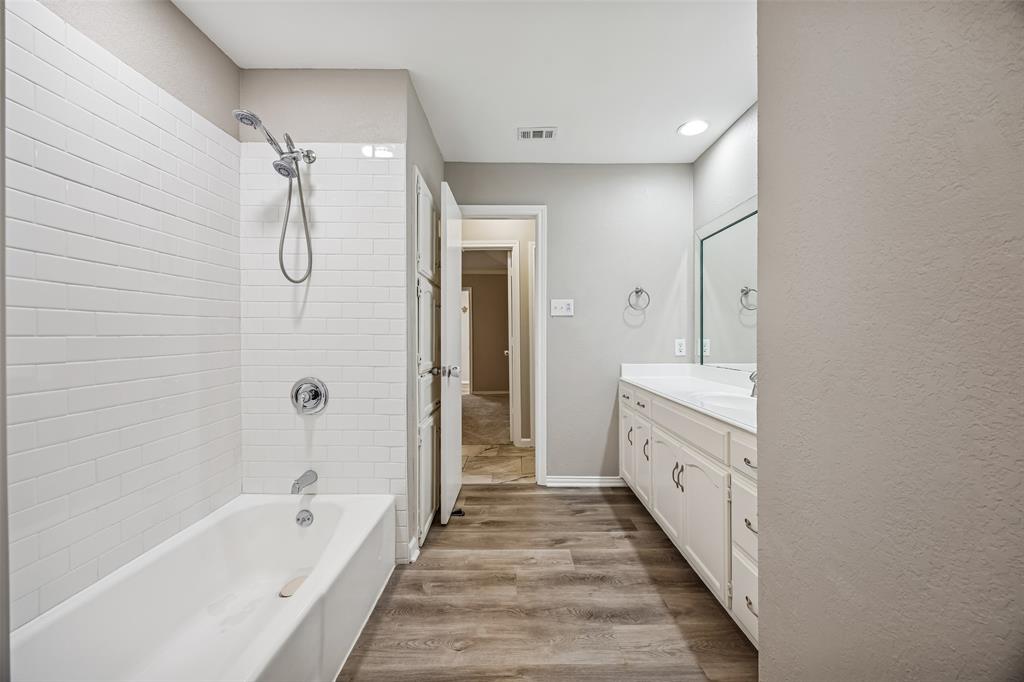 116 Timberview Court Burleson, TX 76028 - Photo 23 of 37 a spacious bathroom with a tub sink shower and mirror