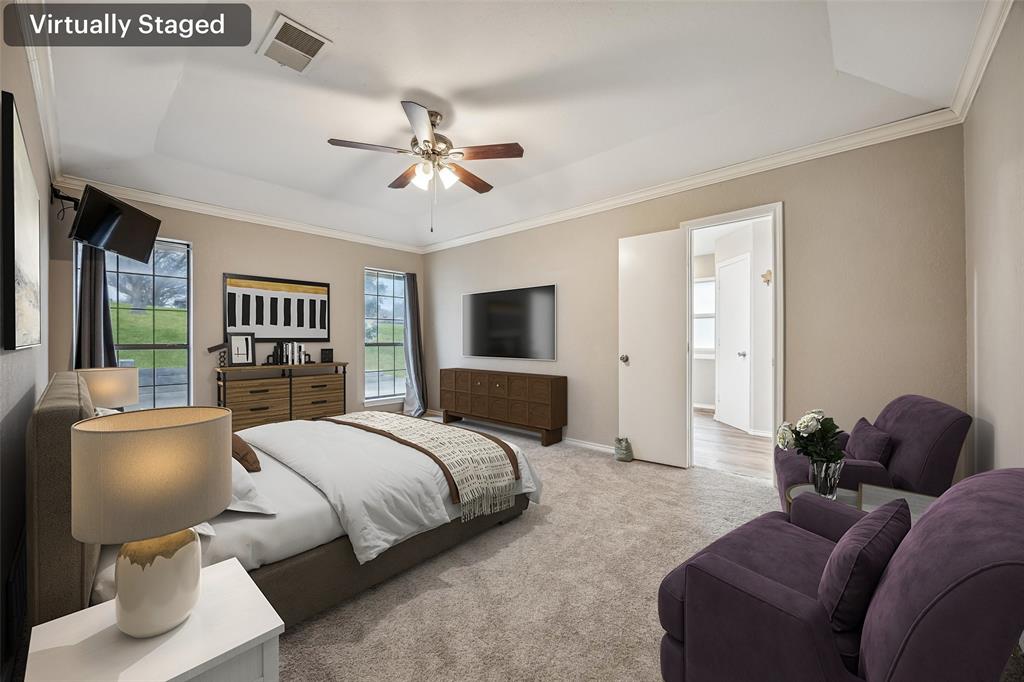 116 Timberview Court Burleson, TX 76028 - Photo 24 of 37 a bedroom with a bed and wooden floor