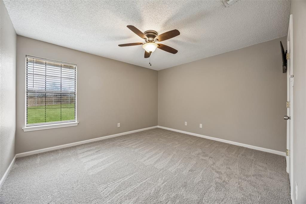 116 Timberview Court Burleson, TX 76028 - Photo 26 of 37 an empty room with window and ceiling fan