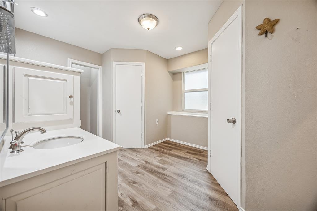 116 Timberview Court Burleson, TX 76028 - Photo 27 of 37 a bathroom with a sink and a mirror
