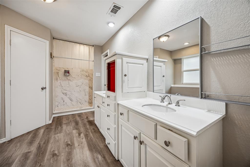 116 Timberview Court Burleson, TX 76028 - Photo 28 of 37 a bathroom with a double vanity sink mirror and shower