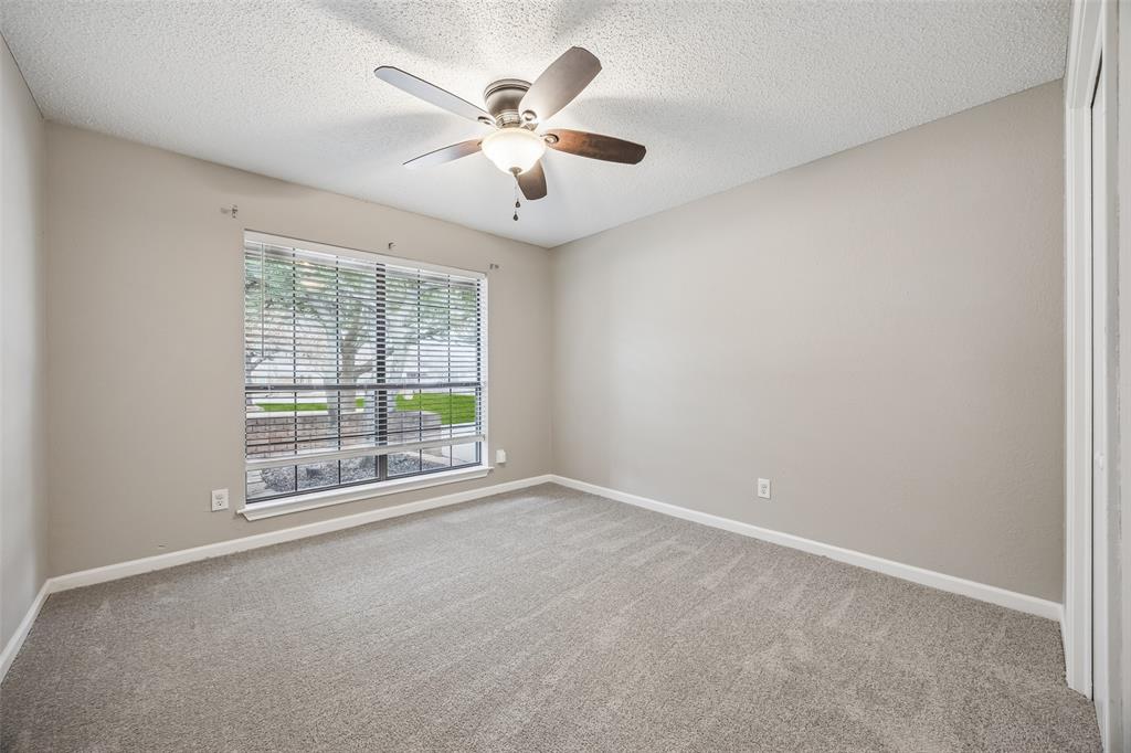 116 Timberview Court Burleson, TX 76028 - Photo 30 of 37 an empty room with chandelier fan and windows