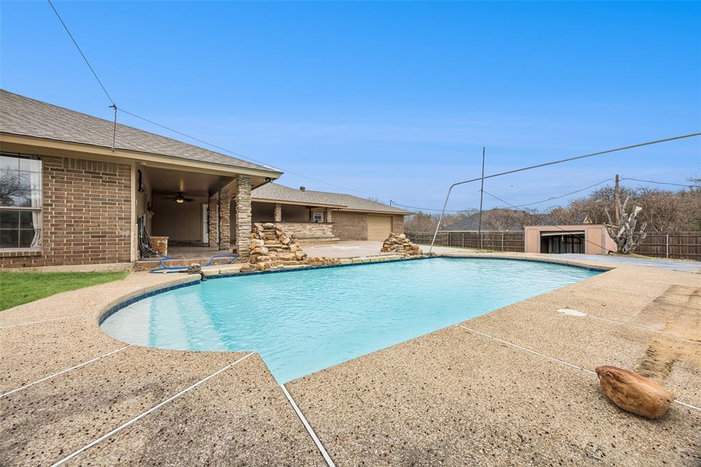 116 Timberview Court Burleson, TX 76028 - Photo 3 of 37 a view of a house with pool and chairs
