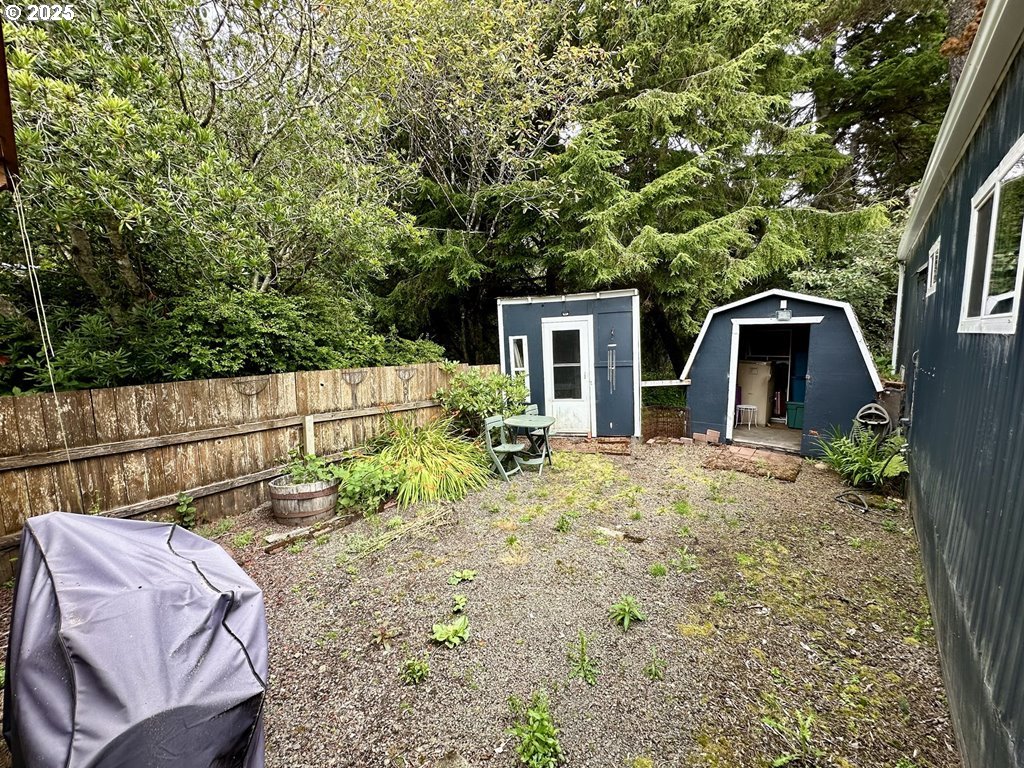 4875 Highway 101, Unit 93 Depoe Bay, OR 97341 - Photo 9 of 13 a backyard of a house with seating space