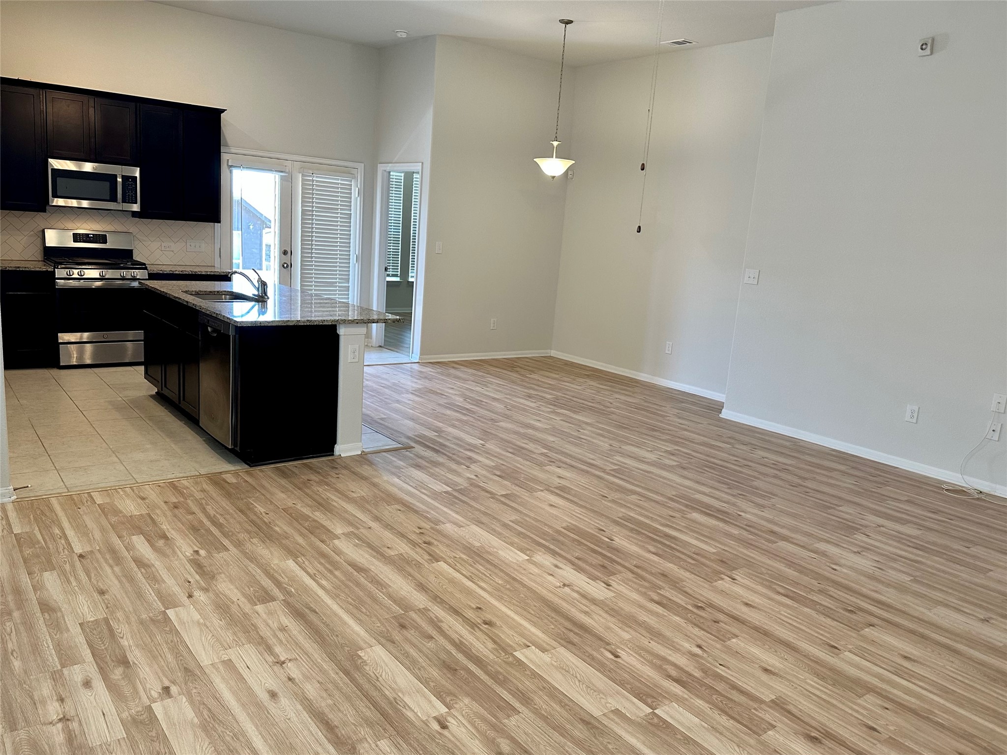 1003 Cherrystone Loop Buda, TX 78610 - Photo 4 of 27 a view of a kitchen from the kitchen