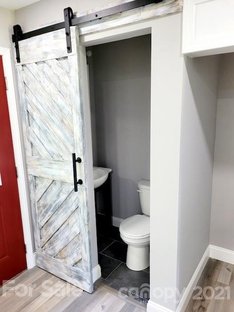 580 Coley Road Salisbury, NC 28146 - Photo 13 of 14 a bathroom with a toilet and a shower
