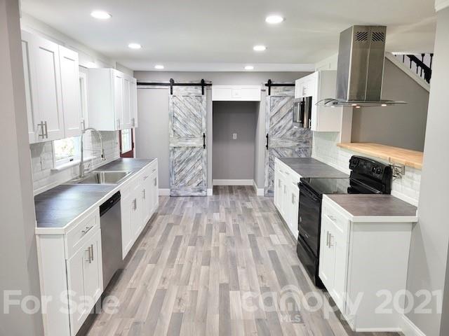 580 Coley Road Salisbury, NC 28146 - Photo 3 of 14 a kitchen with granite countertop a sink stove and refrigerator