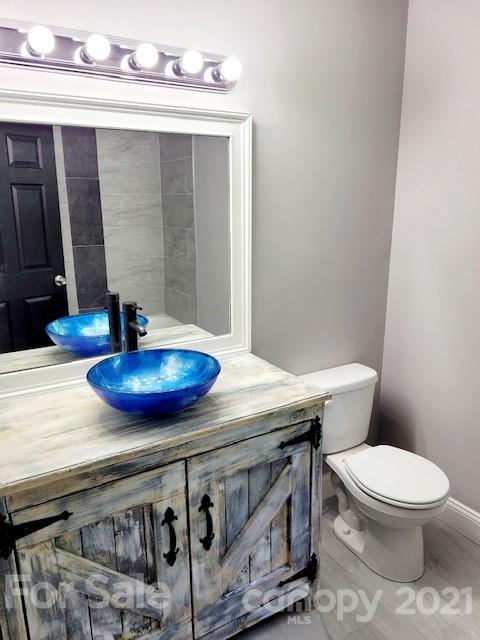 580 Coley Road Salisbury, NC 28146 - Photo 9 of 14 a bathroom with a sink a toilet and mirror