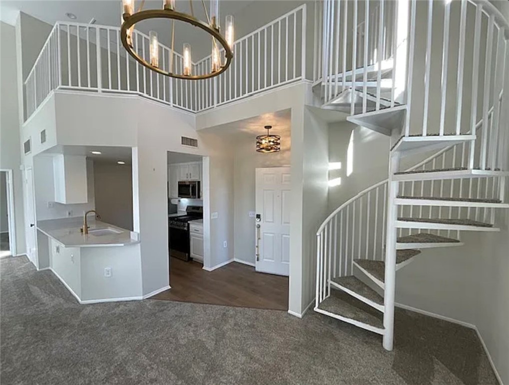 20000 Plum Canyon Road, Unit 225 Saugus, CA 91350 - Photo 2 of 12 a view of an entryway with wooden floor and windows