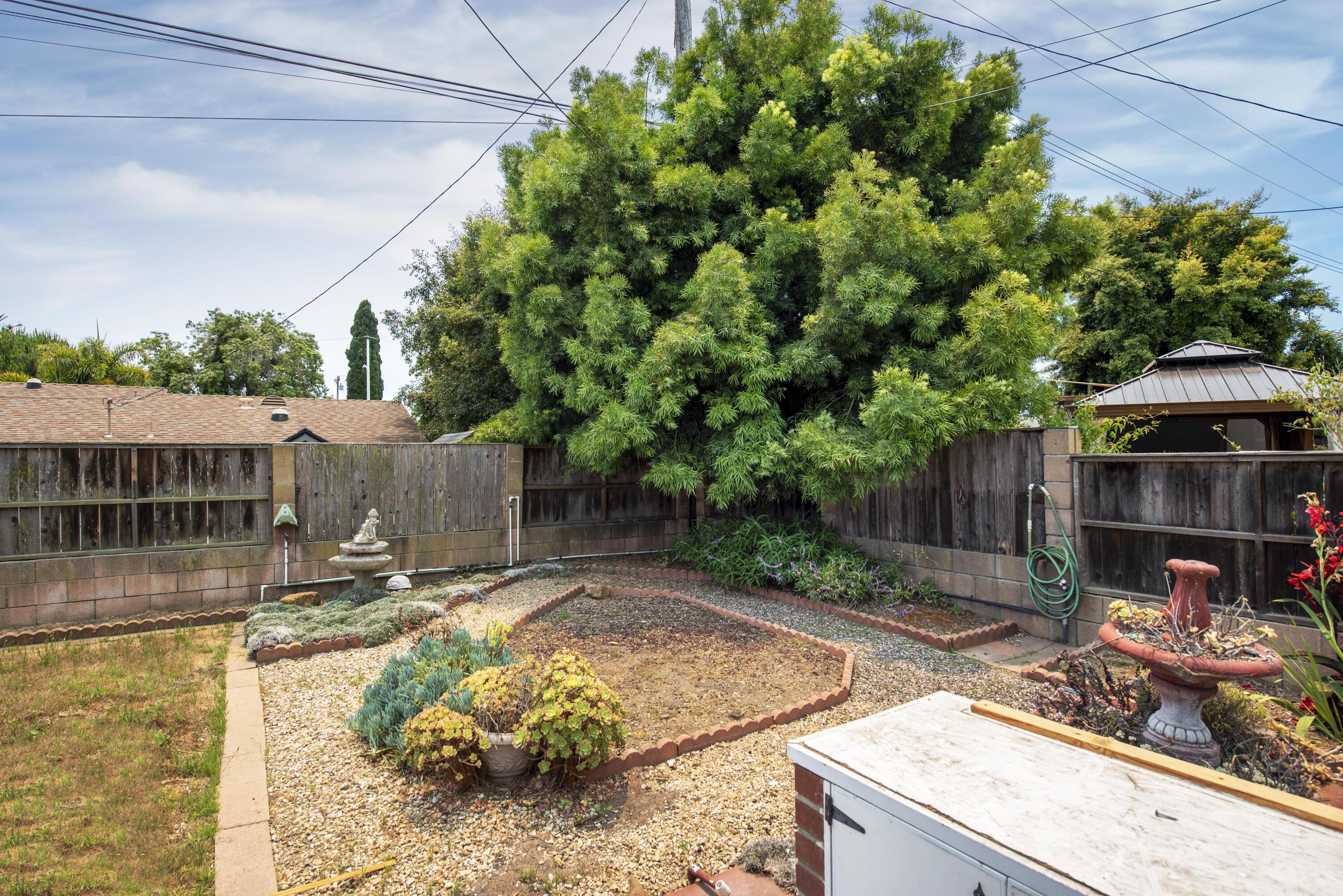 6237 Momouth Avenue Goleta, CA 93117 - Photo 18 of 20 a backyard of a house with yard and outdoor seating