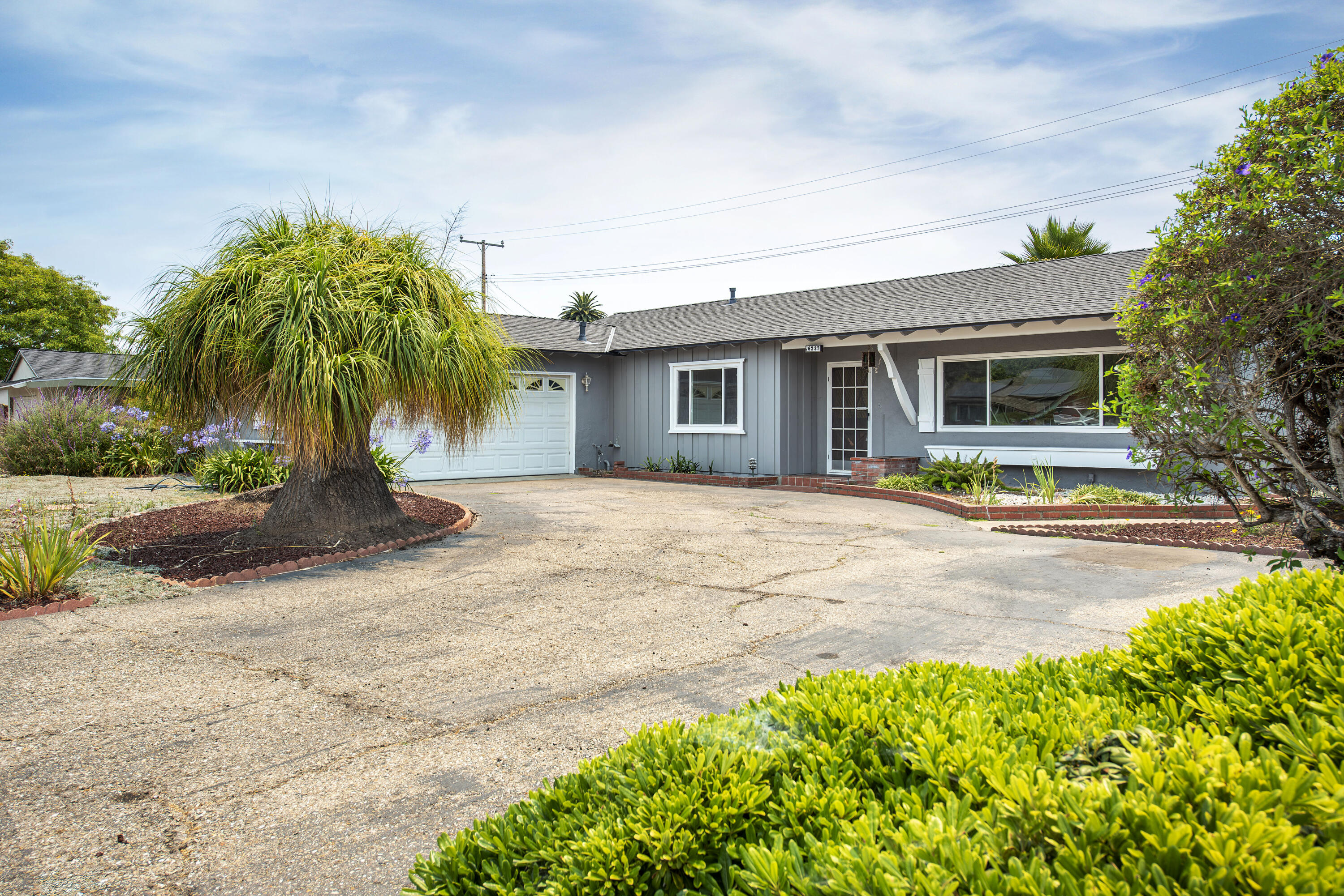 6237 Momouth Avenue Goleta, CA 93117 - Photo 2 of 20 a view of a house with a yard and potted plants