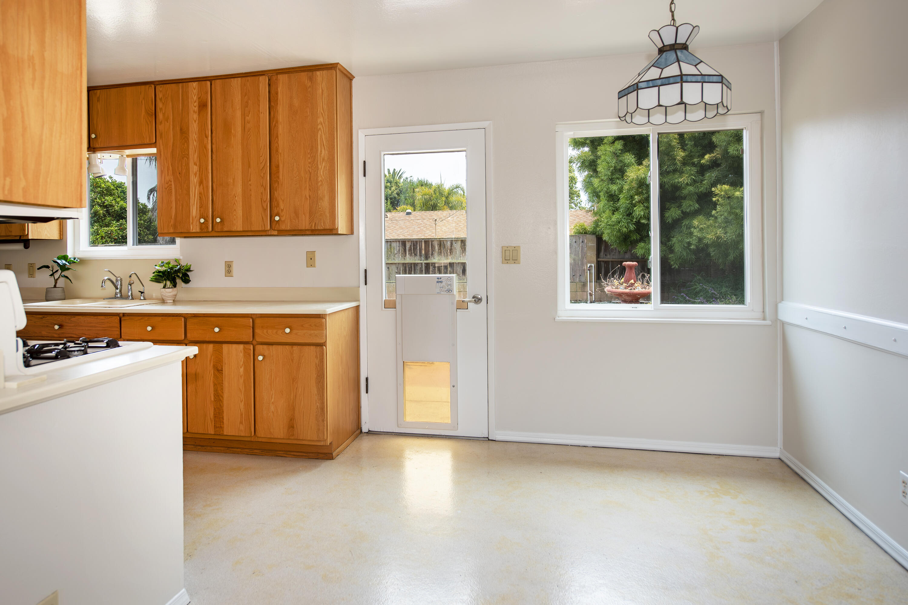 6237 Momouth Avenue Goleta, CA 93117 - Photo 5 of 20 a view of a kitchen with a sink dishwasher and a window