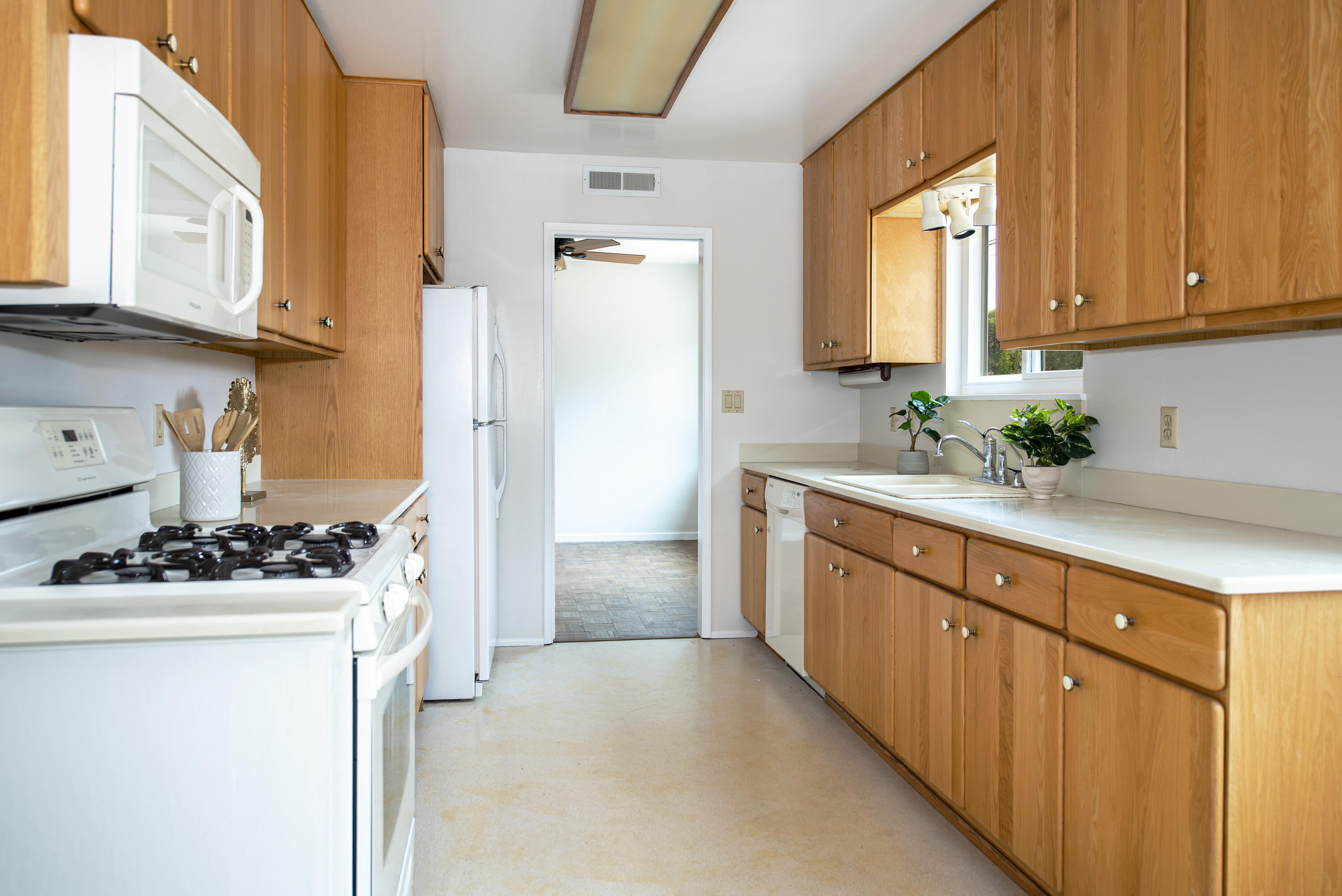 6237 Momouth Avenue Goleta, CA 93117 - Photo 6 of 20 a kitchen with stainless steel appliances a sink stove and cabinets
