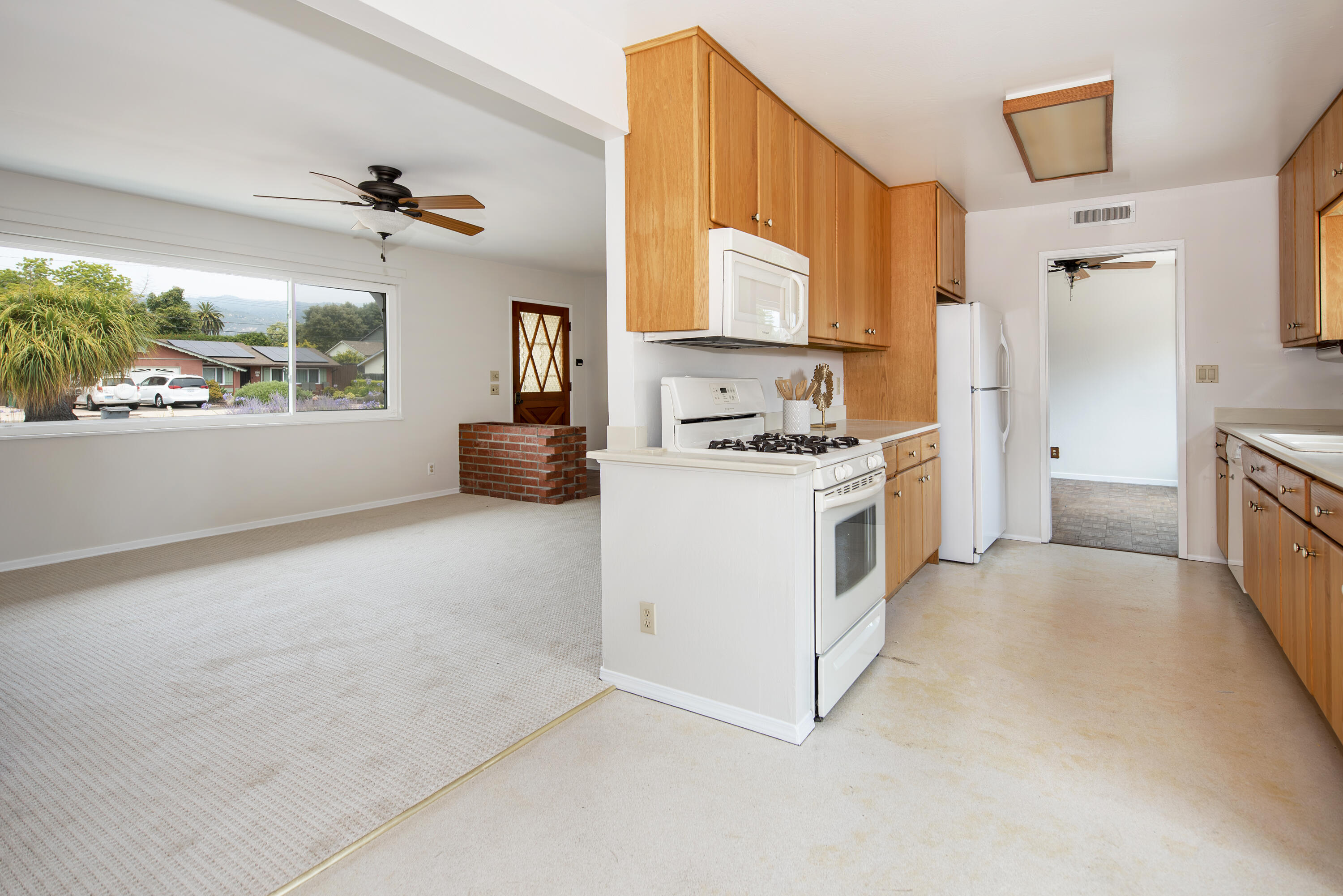 6237 Momouth Avenue Goleta, CA 93117 - Photo 7 of 20 a kitchen with a stove a sink and a refrigerator