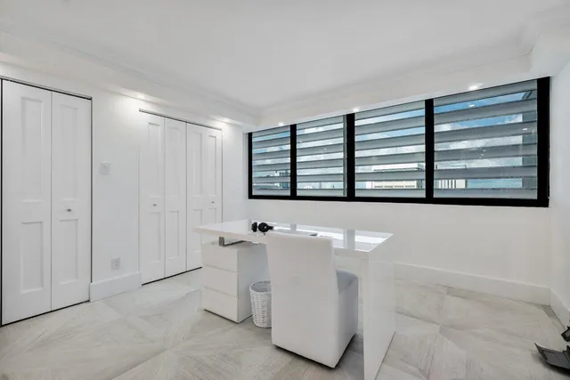 a bathroom with a toilet a sink a mirror a vanity and shower