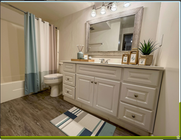 169 East 100 North, Unit B Logan, UT 84321 - Photo 6 of 11 Bathroom with vanity, large mirror and bath/shower combination
