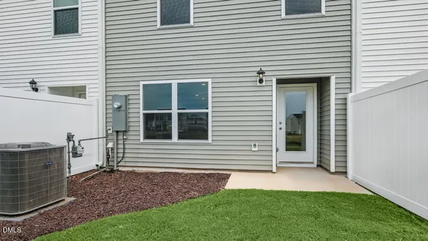 a view of a house with a yard and a garage