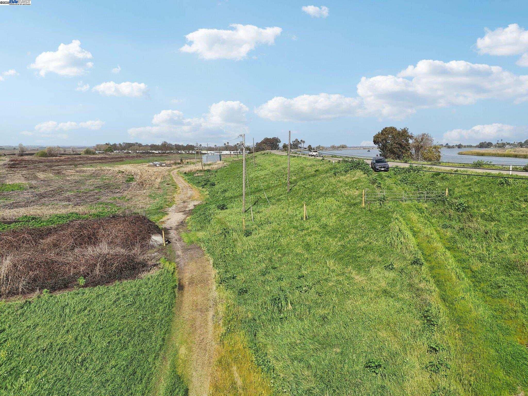 0 Brannan Isle Road Isleton, CA 95641 - Photo 16 of 19 a view of a lake with a yard