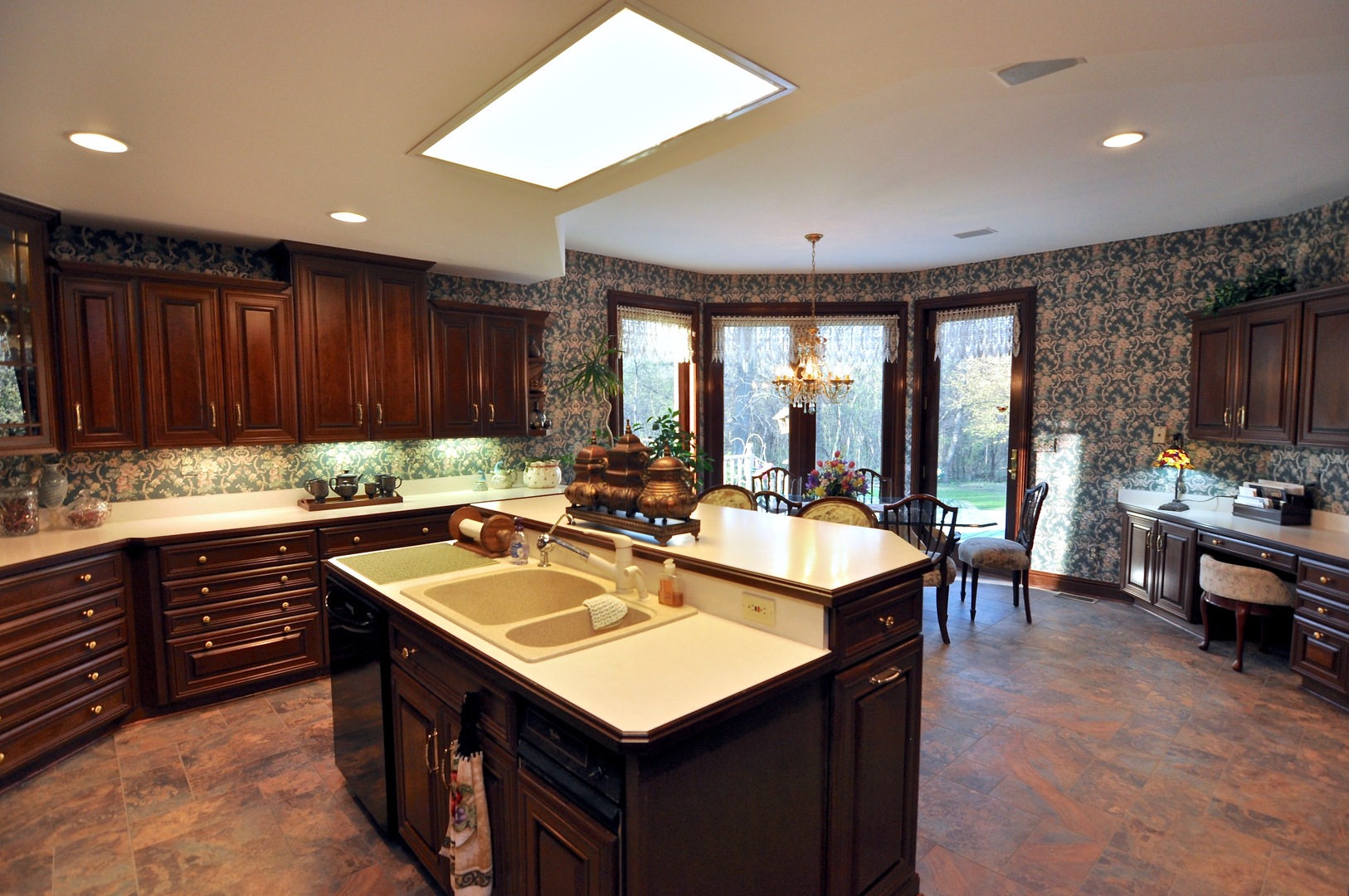 16161 Whipple Road Sycamore, IL 60178 - Photo 14 of 45 a kitchen with wooden cabinets a sink dishwasher and a stove with wooden floor
