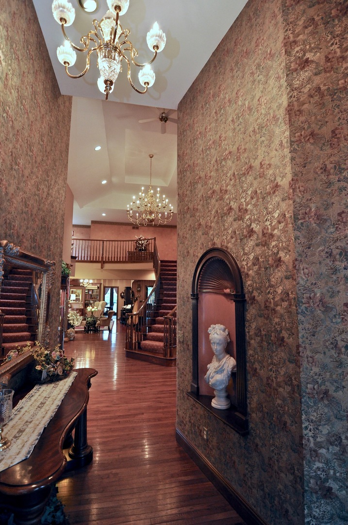 16161 Whipple Road Sycamore, IL 60178 - Photo 18 of 45 a view of a dining room with furniture chandelier and wooden floor