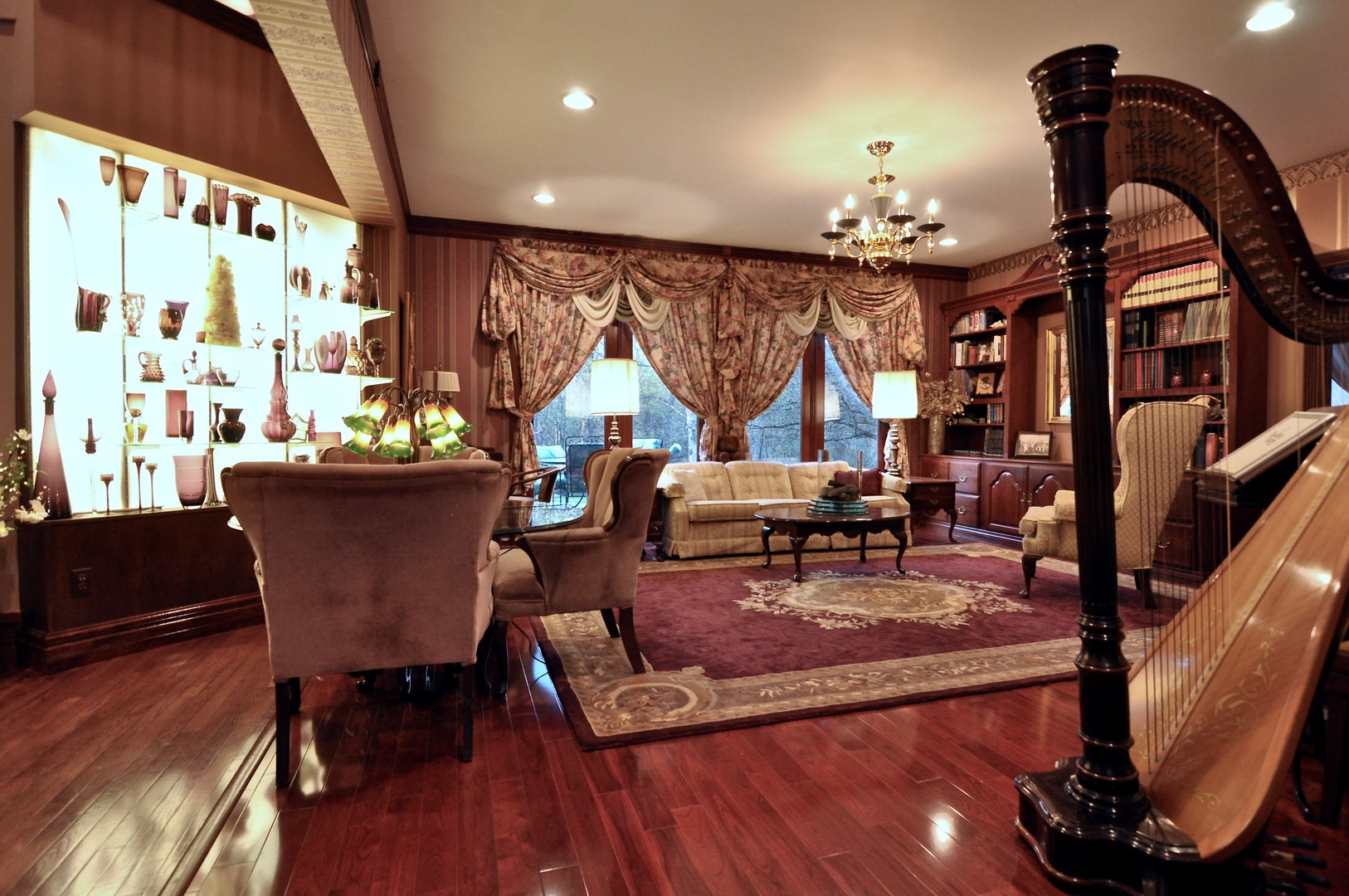 16161 Whipple Road Sycamore, IL 60178 - Photo 21 of 45 a living room with furniture a rug and a chandelier