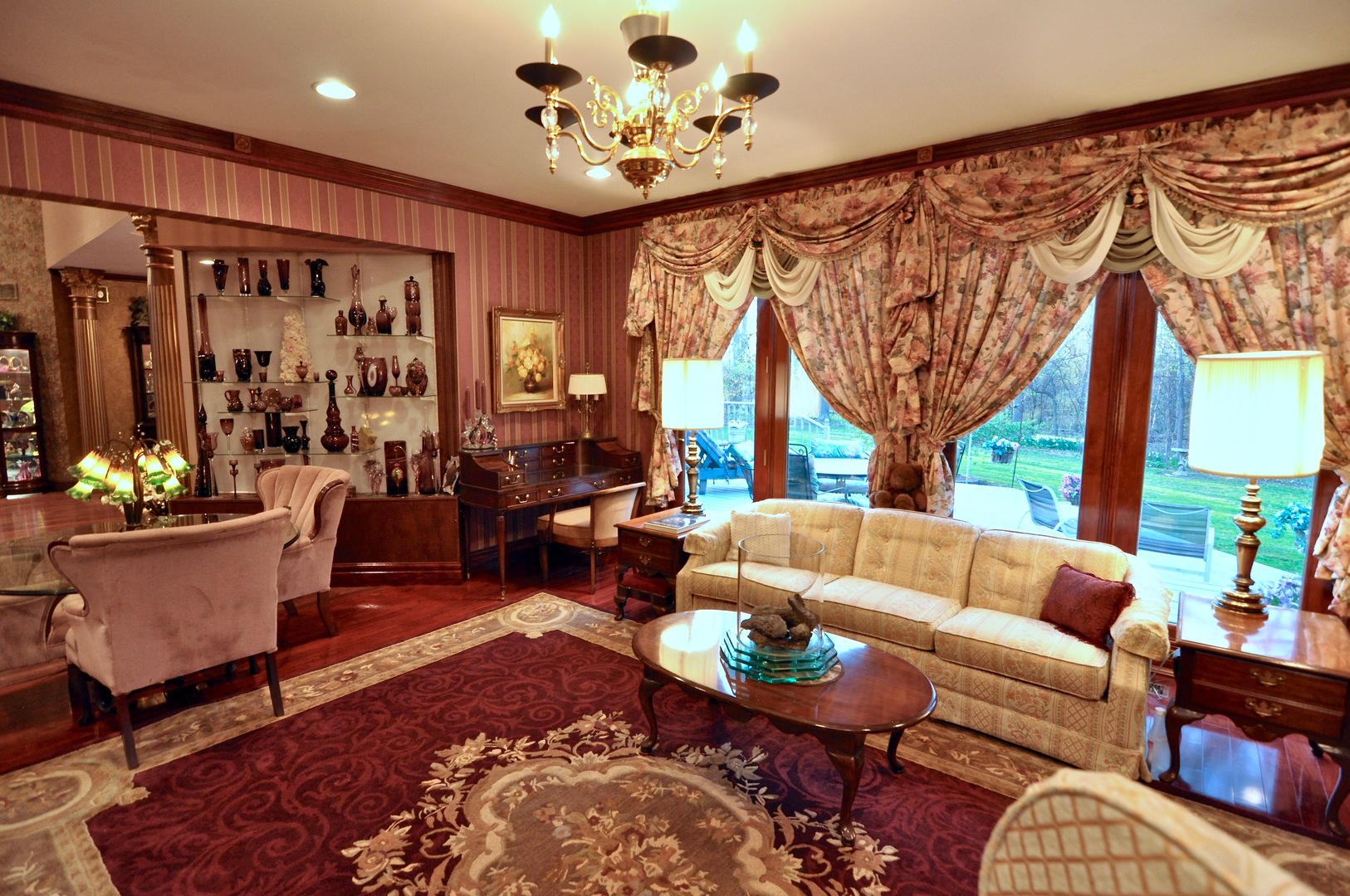 16161 Whipple Road Sycamore, IL 60178 - Photo 22 of 45 a living room with furniture potted plant and a large window