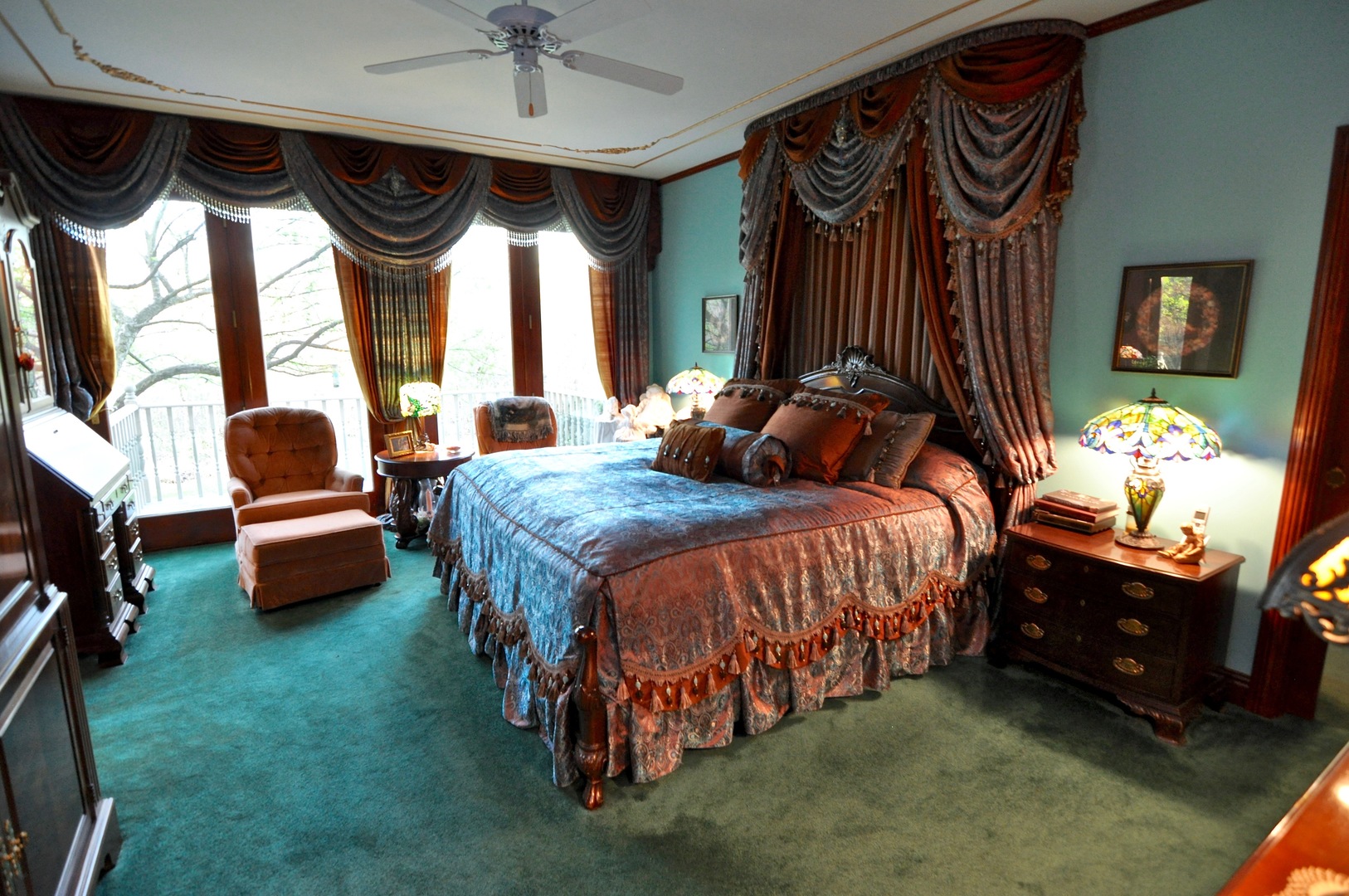 16161 Whipple Road Sycamore, IL 60178 - Photo 27 of 45 a spacious bedroom with a bed and a chandelier