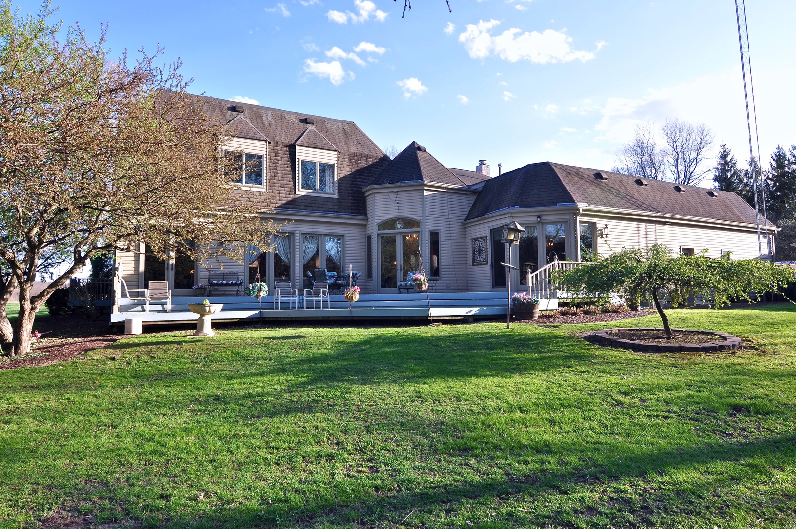16161 Whipple Road Sycamore, IL 60178 - Photo 6 of 45 a front view of house with yard barbeque and outdoor seating
